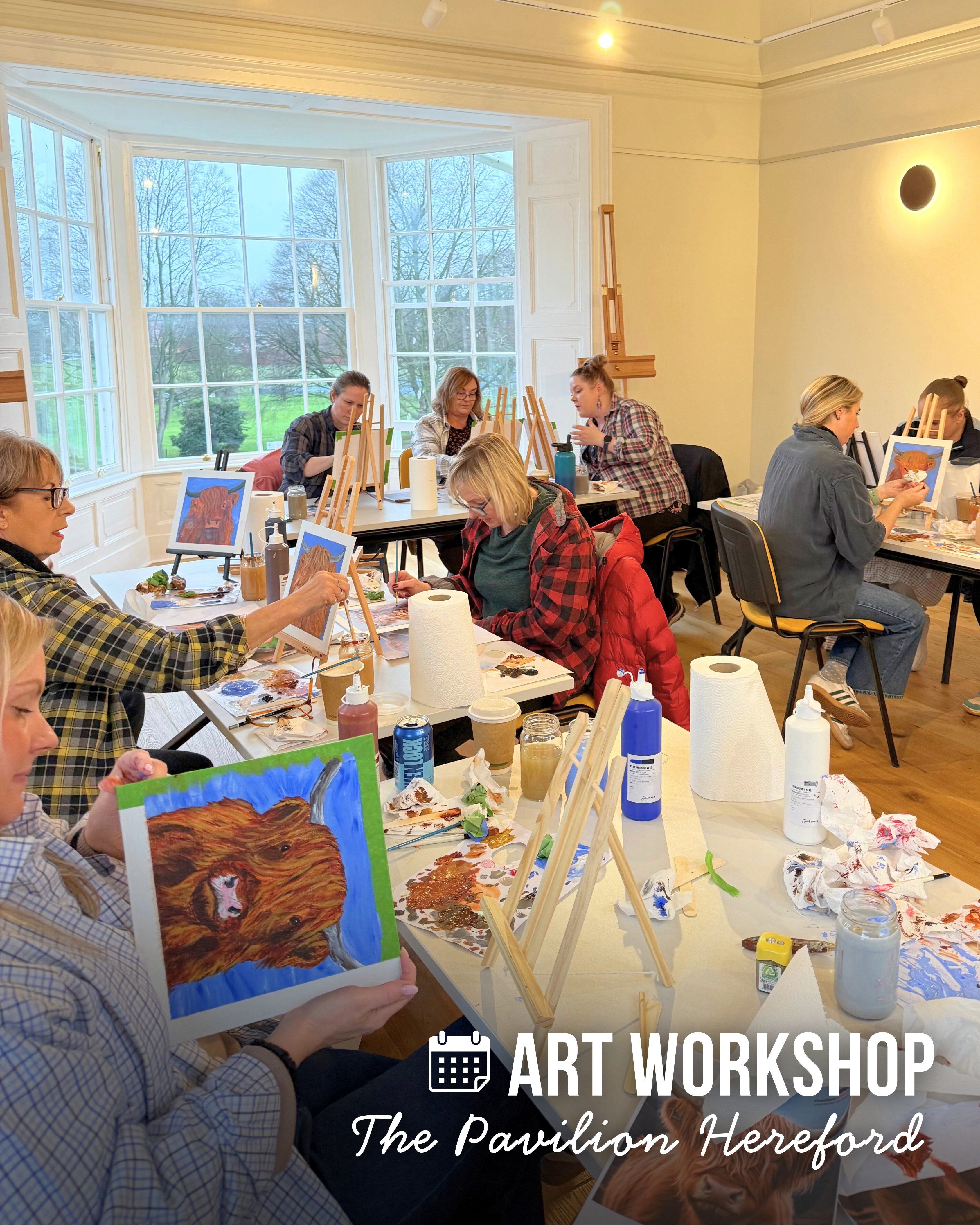 Art workshop at The Pavilion Hereford with participants painting and displaying their artwork.