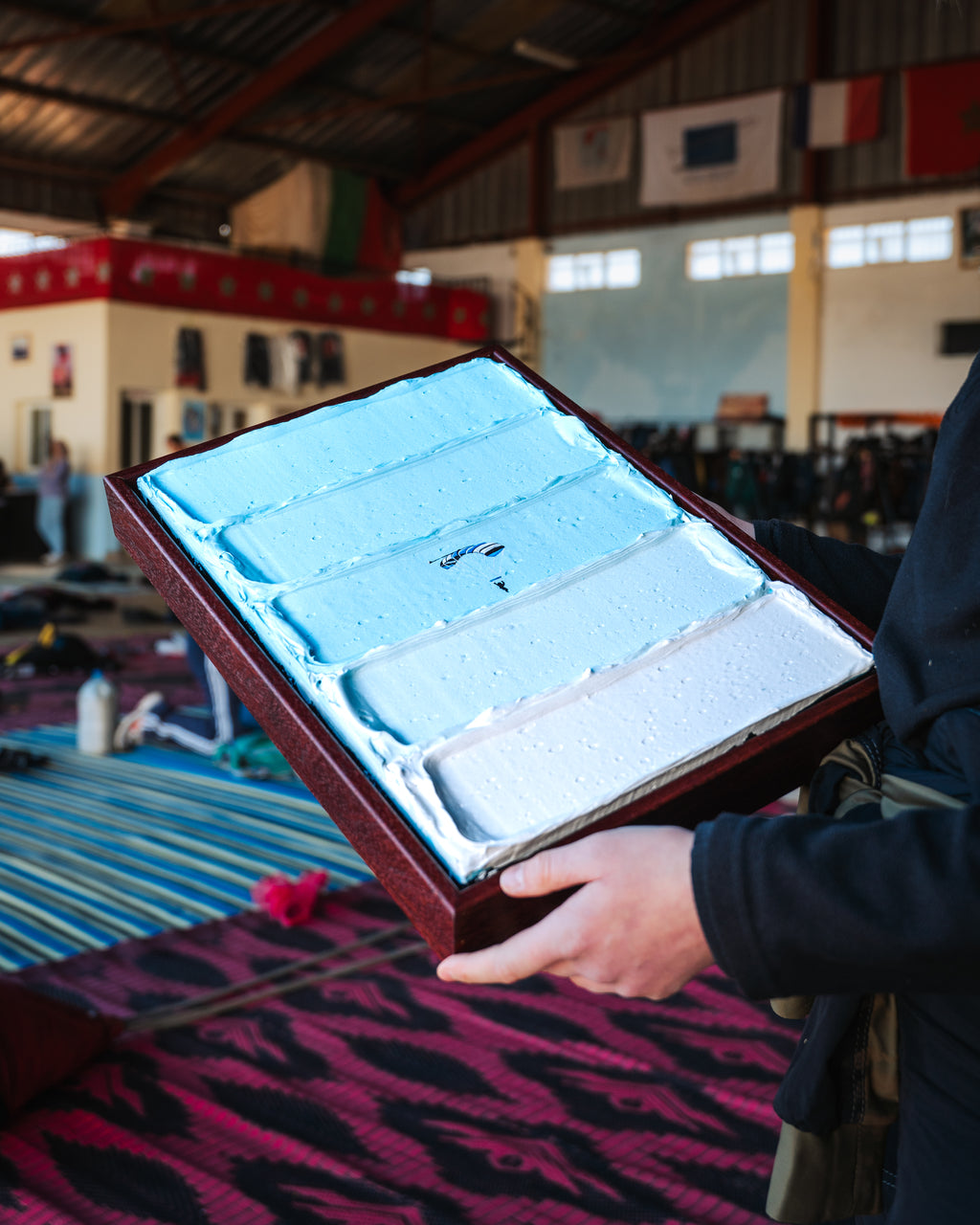 Framed original skydiving painting Above Atlas Skies in a natural wooden floating frame