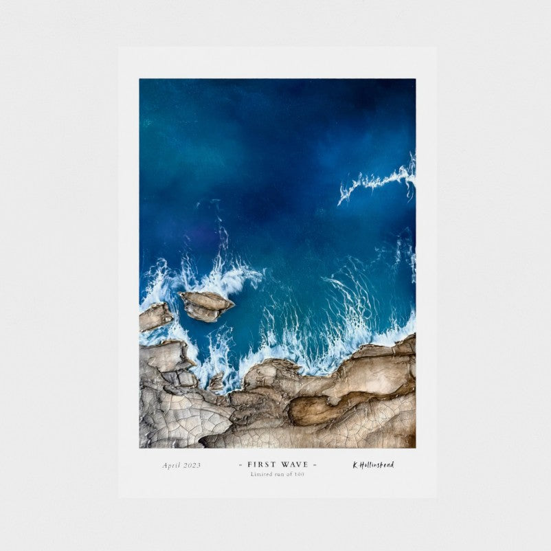 Aerial view of waves crashing against rocks with 'First Wave' text on a white background