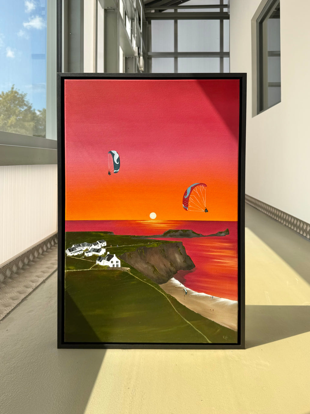 Katie Hollinshead original Rhossili oil painting of paragliding and parakite wings over the coast